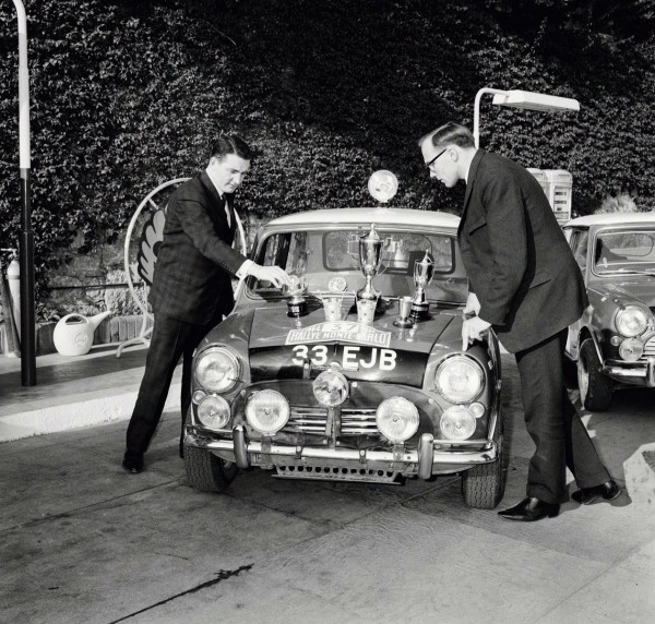 Paddy counts the silverware while his co driver Henry Liddon looks on.