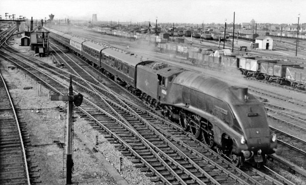 Eastern Glory Days - A Gresley designed A4 Pacific coasts past Peterborough North signal box with an up-fast Kings Cross bound service.