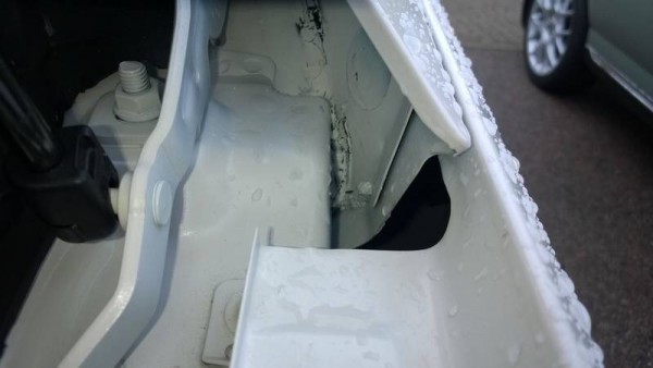 Its here where the wheels fall off. The finish in the inner wings is an utter shambles with duct tape, plastic sealant and messy overspray on full view. Simply NOT acceptable at any price!