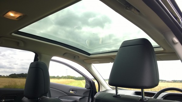 This top of the range "EX" model features lavish features such as electric adjusting leather seats with heating and memory position setting function and this huge panoramic roof with electric sunblind.