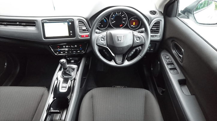 Snug and comfy driving position is let down by fiddly touch sensitive climate panel and spindly gear knob.